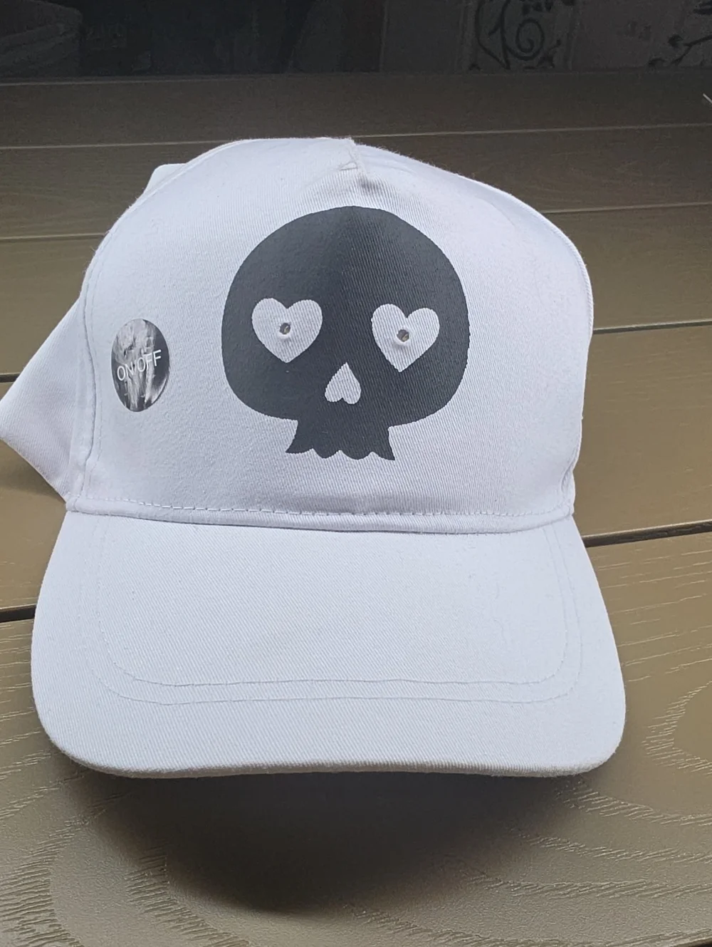 White Cap with Light Up Heart-Eye Skull Graphic